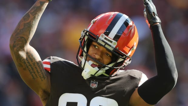 Cleveland Browns cornerback Greg Newsome II (20) gets the crowd pumped up on third down during the first half of an NFL football game against the Pittsburgh Steelers, Sunday, Oct. 31, 2021, in Cleveland, Ohio.